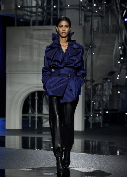 A cobalt ruffle over leather trousers