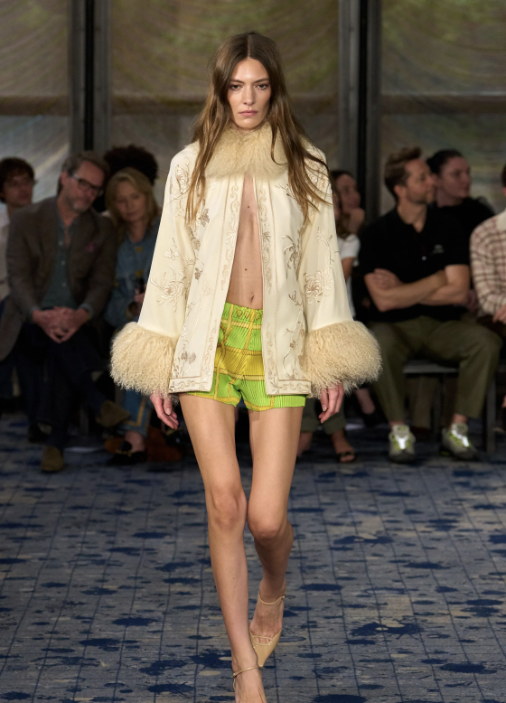 A shearling-trimmed coat over neon green