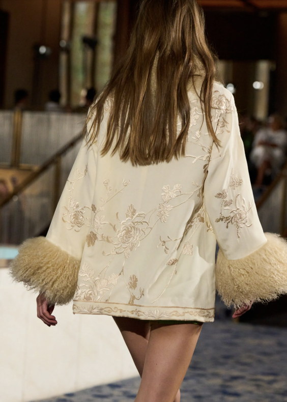 Feathered cuffs on a cream mini