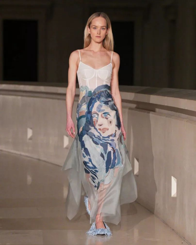 Erdem AW25 runway look: corset gown with a painted portrait print