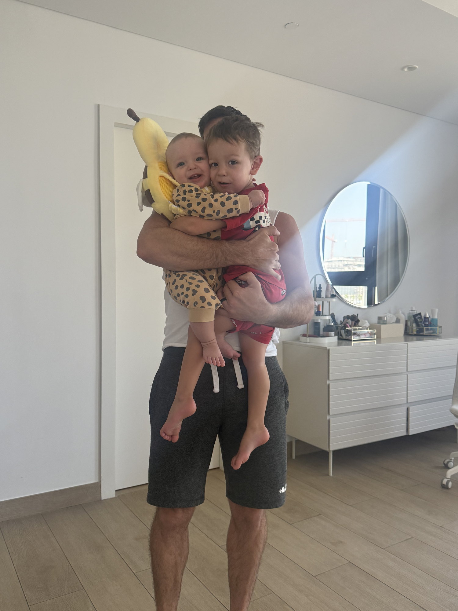 Mark holding both of his sons