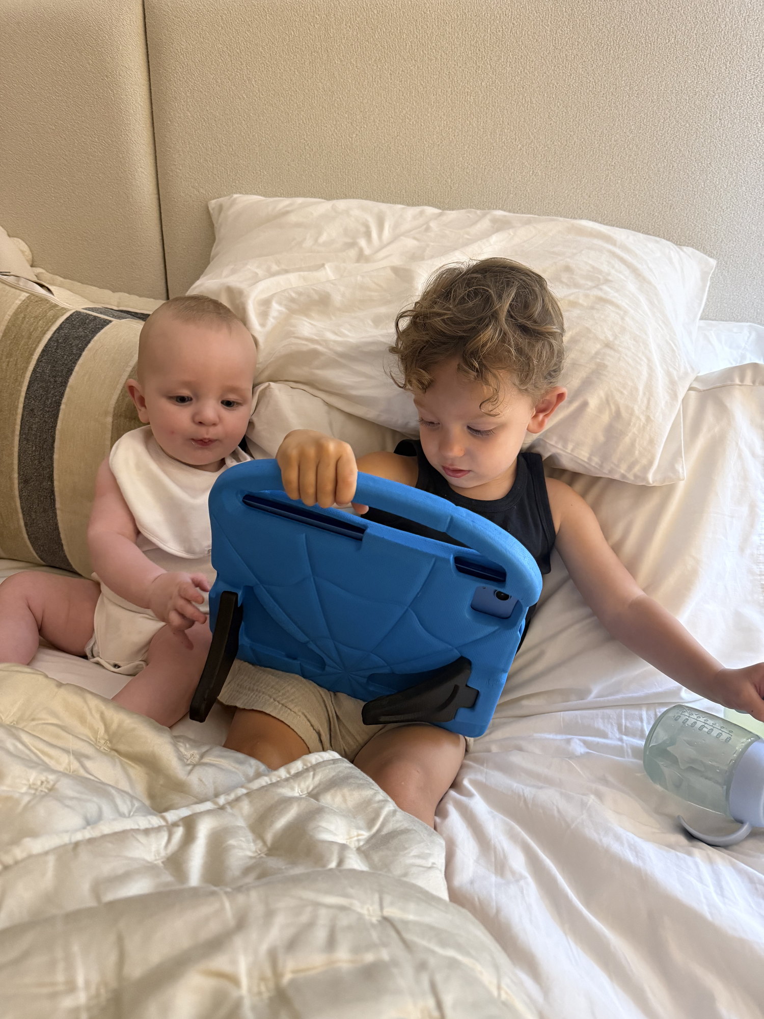 Weston and Aurelius together on the bed