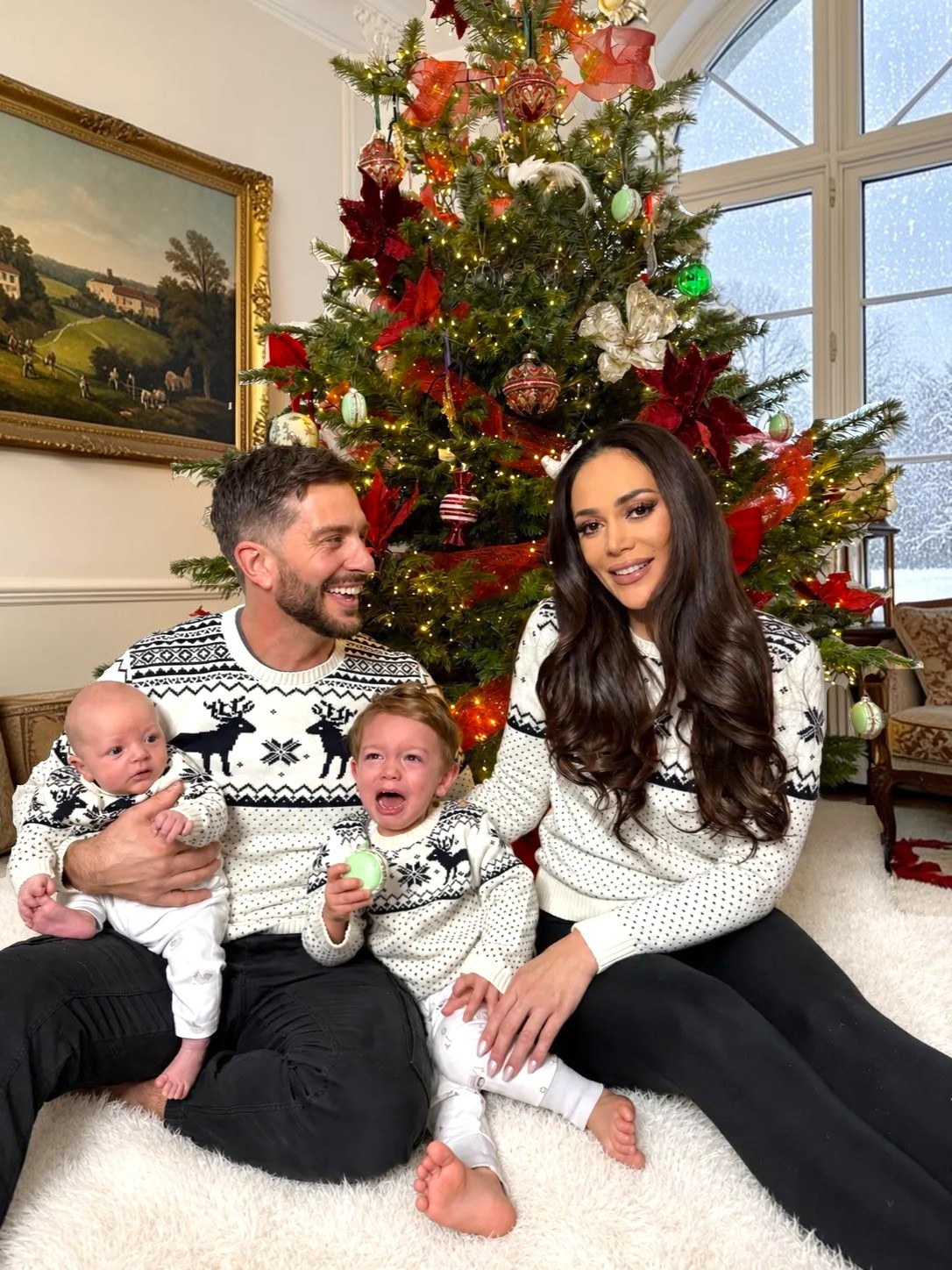 Chelsea Green with Mark, Weston and Aurelius by the Christmas tree