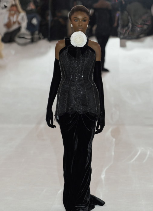 Black velvet, drawn long and lean