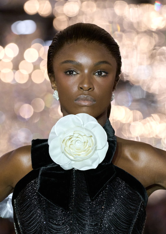 The camellia, worn at the throat