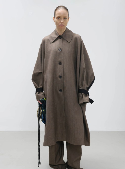 The coat, cut enormous