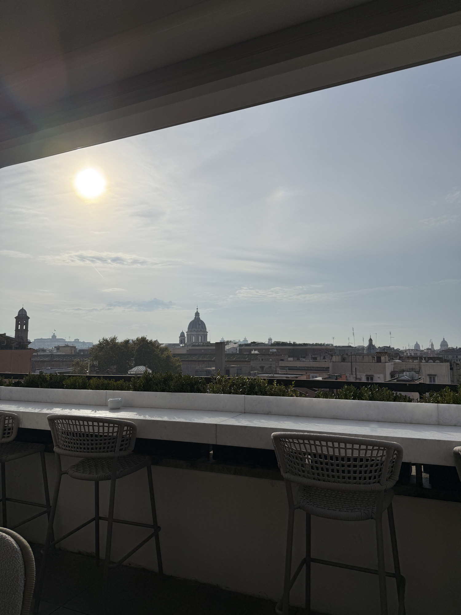 The rooftop view over Rome at golden hour