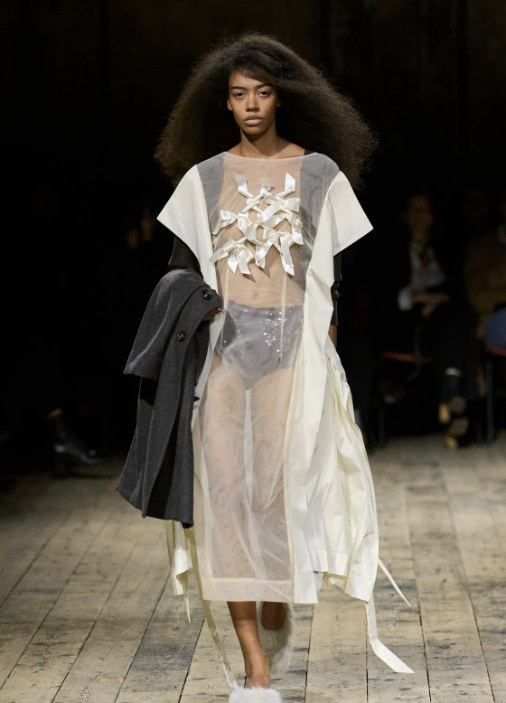 A tailored jacket thrown over organza